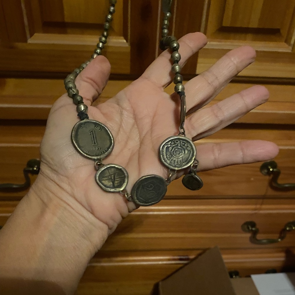 Authentic Love Tokens coin necklace . Long length. Never worn .